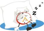 Good Rest means sleeping better, and a good pillow is an important start, as illustrated by this alam clock sleeping against a big pillow.