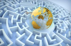 Field Mission Dilemma is today also working in a maze of politics illustrated by world globe in centre of a maze.