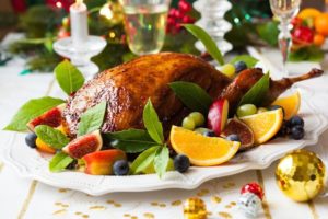 Christmas Feeling can be special foods that you like., illustrated by Duck surrounded by fruit.