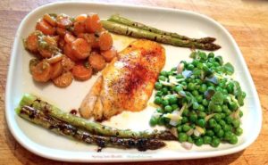 Recipe for Spring in picture with pistachio pesto carrots , lemon minted peas, grilled asparagus and saffron fish fillet.