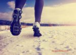 London Marathon preparation in winter time, illustrated by runner in snow.