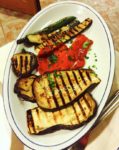 Italian feast antipasti illustrated by grilled vegetables.