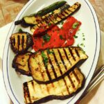 Italian feast antipasti illustrated by grilled vegetables.